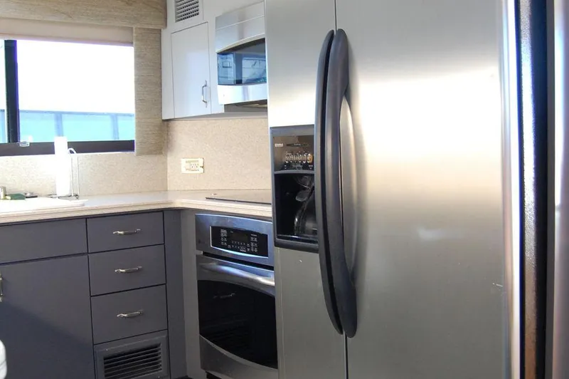 Slide: The Image of Modern kitchen in 1990 Hatteras 78 Aft Cockpit Motoryacht with stainless steel appliances. - 37