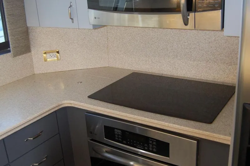 Slide: The Image of Modern kitchen in 1990 Hatteras 78 Aft Cockpit Motoryacht with stovetop and microwave. - 38