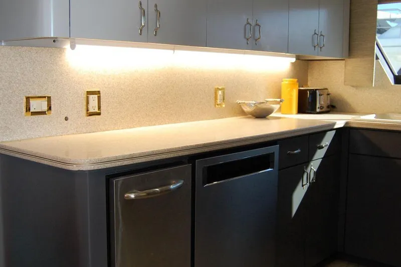 Slide: The Image of Modern kitchen in 1990 Hatteras 78 Aft Cockpit Motoryacht with sleek countertops. - 39