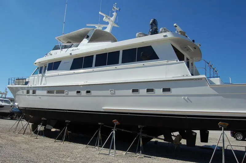Slide: The Image of 1990 Hatteras 78 Aft Cockpit Motoryacht on dry dock. - 4