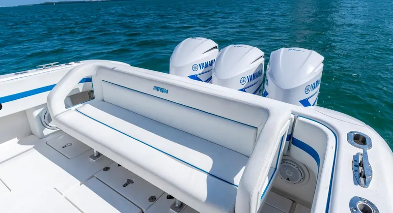 Slide: The Image of 2011 Intrepid 400 Cuddy boat with Yamaha engines on blue water. - 12