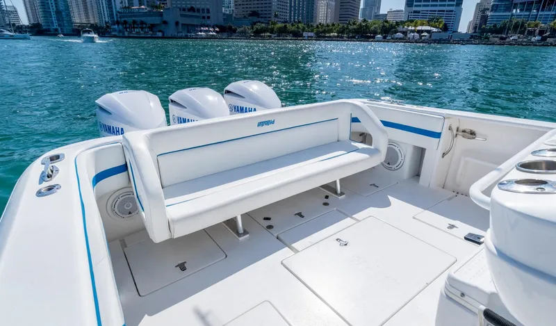Slide: The Image of 2011 Intrepid 400 Cuddy boat with Yamaha engines on a sunny day. - 13