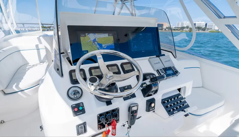 Slide: The Image of 2011 Intrepid 400 Cuddy boat helm with navigation system and controls. - 16