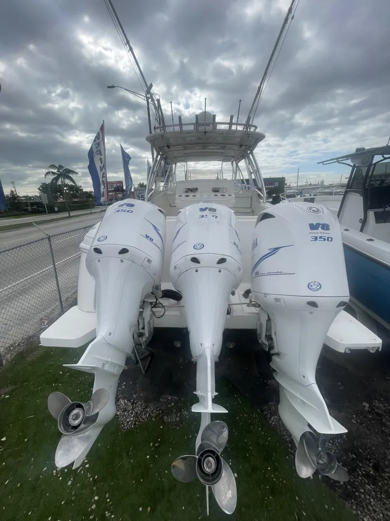 Slide: The Image of 2011 Intrepid 400 Cuddy with triple Yamaha outboard engines. - 25