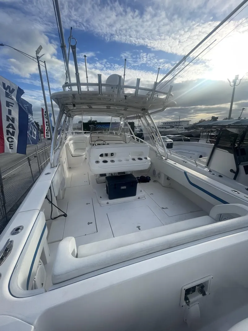 Slide: The Image of 2011 Intrepid 400 Cuddy boat with spacious deck and modern amenities. - 26