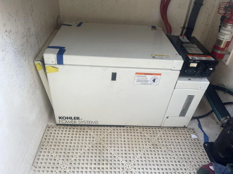 Slide: The Image of Kohler Power Systems generator in a 2011 Intrepid 400 Cuddy boat. - 28