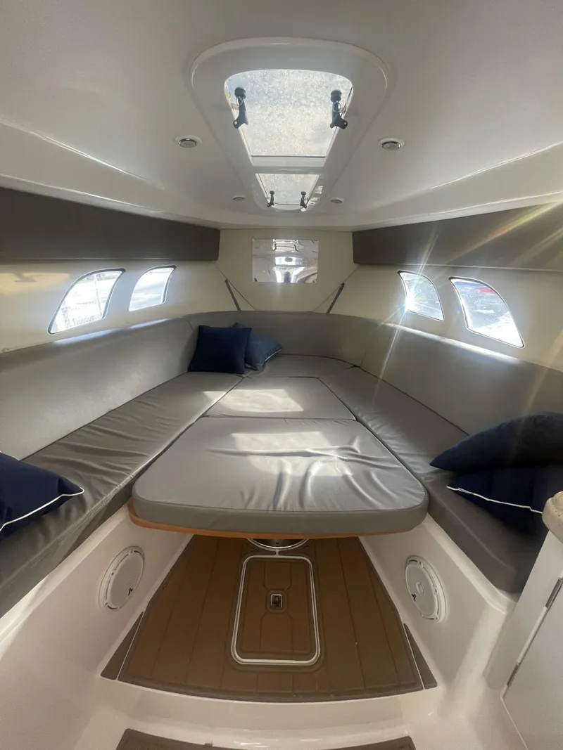 Slide: The Image of 2011 Intrepid 400 Cuddy cabin interior with skylight and seating. - 30