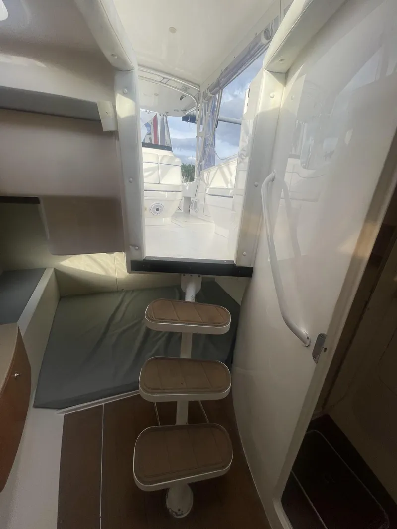 Slide: The Image of Interior view of 2011 Intrepid 400 Cuddy boat with steps leading to deck. - 34