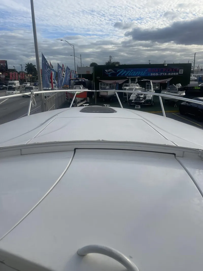 Slide: The Image of 2011 Intrepid 400 Cuddy boat on display at a dealership. - 37