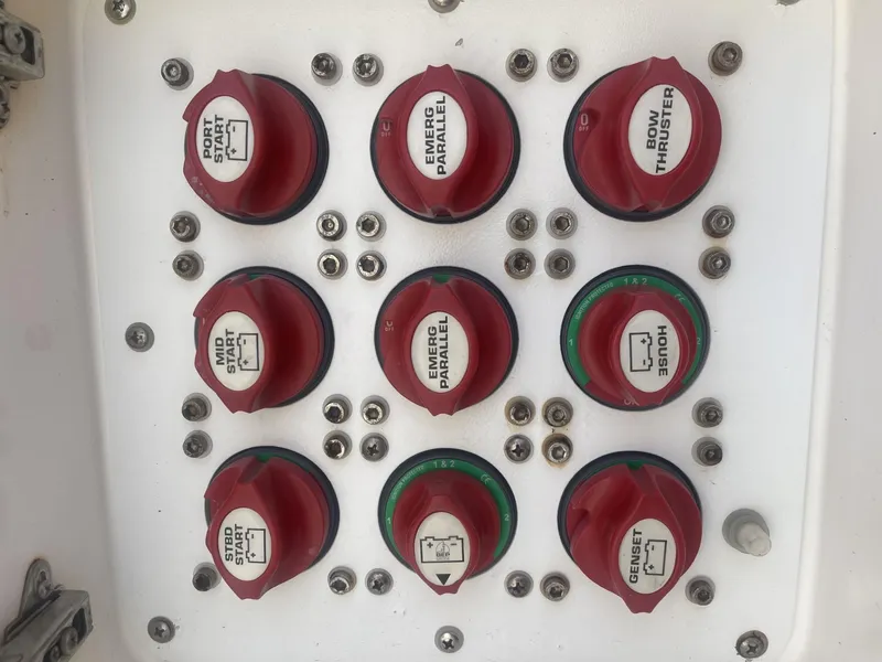Slide: The Image of Control panel of a 2011 Intrepid 400 Cuddy boat with various switches. - 40
