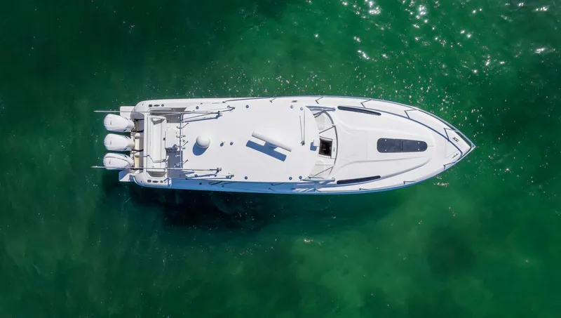 Slide: The Image of Aerial view of a 2011 Intrepid 400 Cuddy boat on clear green water. - 8