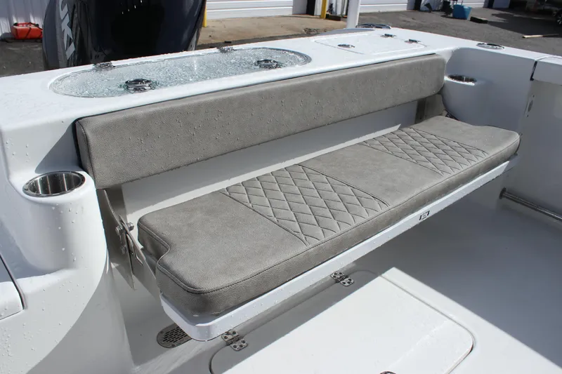 Slide: The Image of 2025 Sea Pro 242 Deep-V boat with cushioned seating and cup holders. - 15
