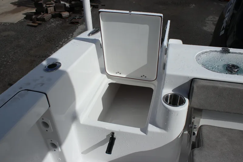Slide: The Image of 2025 Sea Pro 242 Deep-V boat storage compartment and seating area. - 16