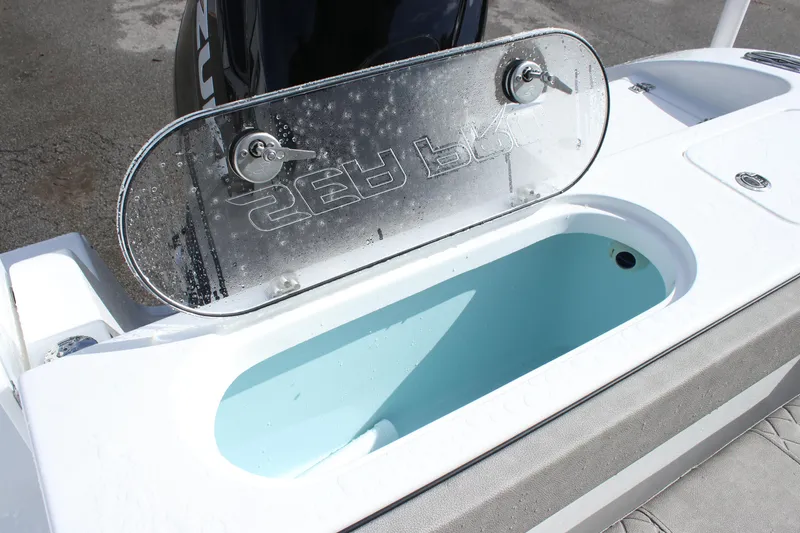 Slide: The Image of 2025 Sea Pro 242 Deep-V boat livewell with open lid. - 17