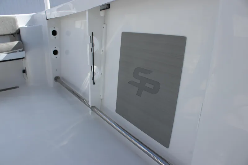 Slide: The Image of 2025 Sea Pro 242 Deep-V boat interior with SP logo and stainless steel railing. - 19