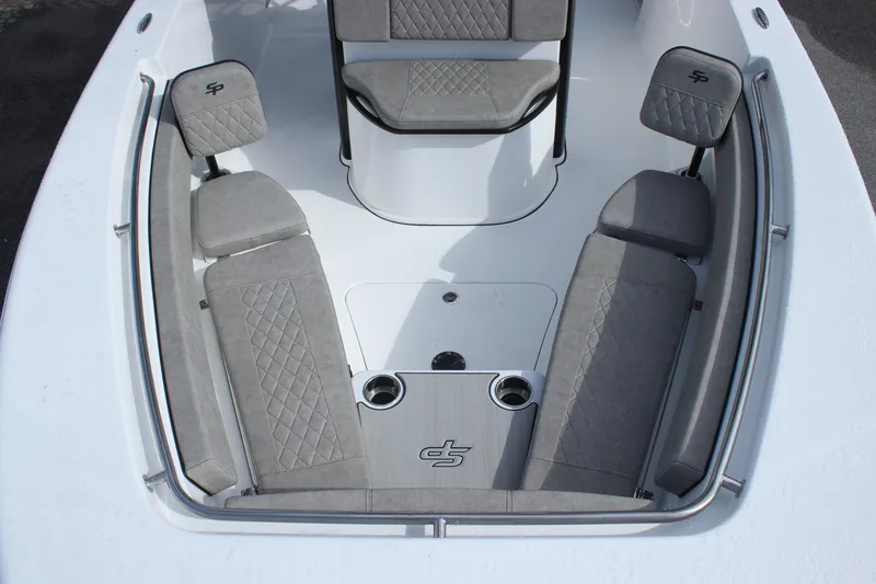 Slide: The Image of 2025 Sea Pro 242 Deep-V boat interior with gray cushioned seating. - 22