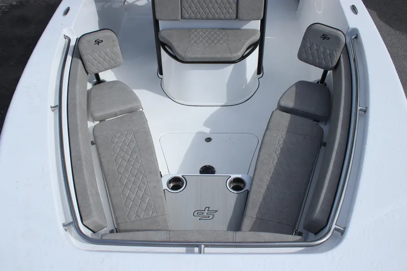 Slide: The Image of 2025 Sea Pro 242 Deep-V boat interior with cushioned seating and storage compartments. - 23