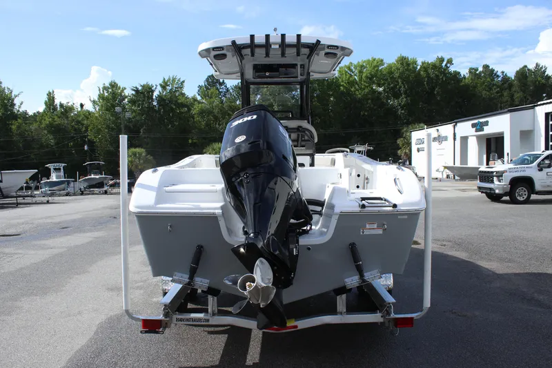 Slide: The Image of 2025 Sea Pro 242 Deep-V boat with outboard motor, rear view in a parking lot. - 5