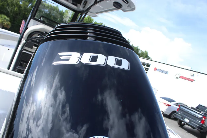 Slide: The Image of Close-up of a 300 HP engine on a 2025 Sea Pro 242 Deep-V boat. - 6