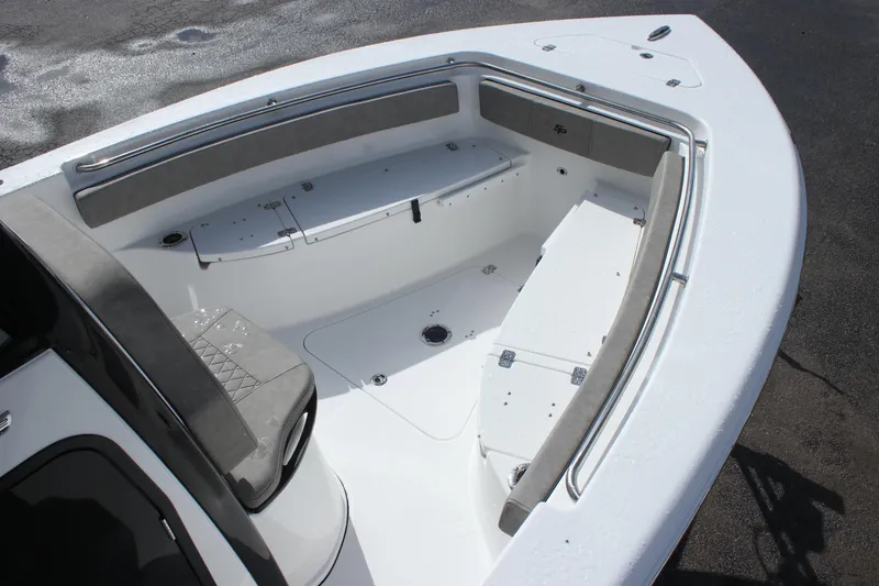 Slide: The Image of 2025 Sea Pro 242 Deep-V boat interior with seating and storage compartments. - 7