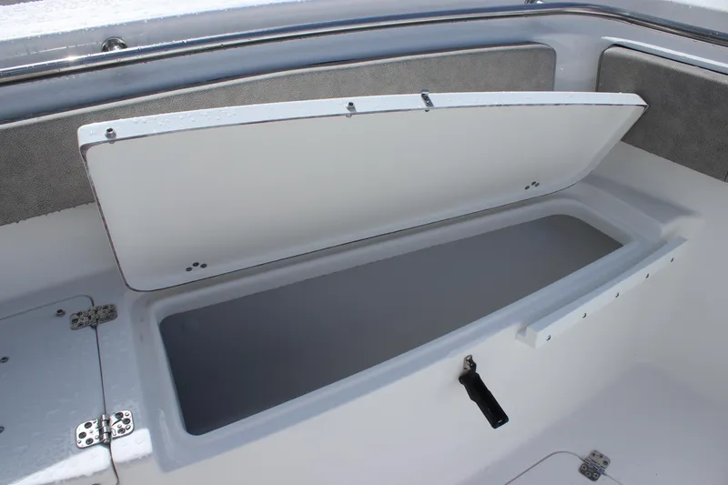 Slide: The Image of Open storage compartment on a 2025 Sea Pro 242 Deep-V boat. - 9