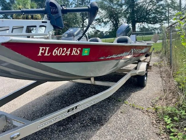 Slide: The Image of 2017 Express XP7 boat on trailer with registration FL 6024 RS. - 2