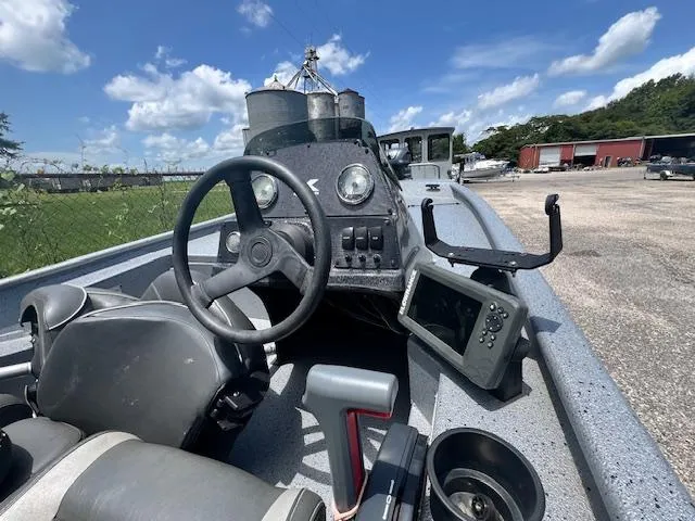 Slide: The Image of 2017 Express XP7 boat dashboard with steering wheel and navigation equipment. - 6