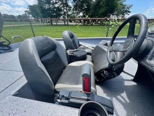 Slide: The Image of 2017 Express XP7 boat interior with steering wheel and seats. - 7