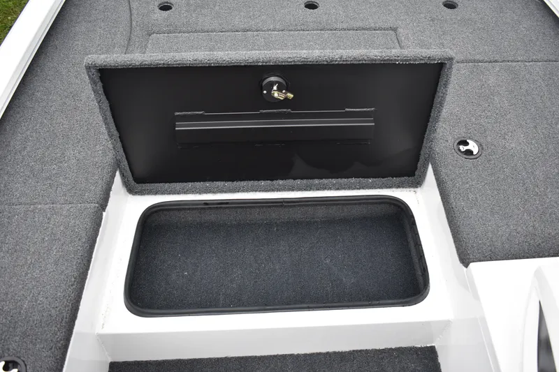 Slide: The Image of 2023 Vexus AVX189C boat storage compartment with open lid. - 10