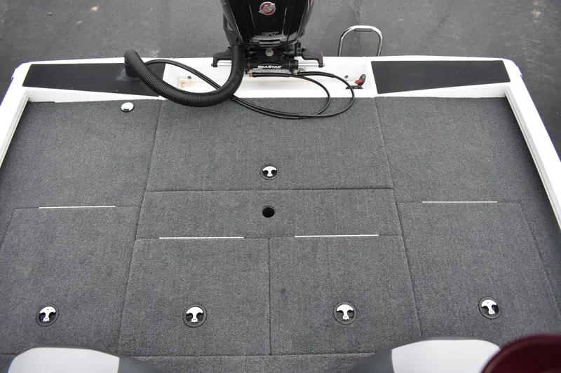 Slide: The Image of 2023 Vexus AVX189C boat deck with storage compartments and motor. - 15