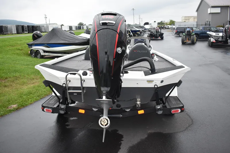 Slide: The Image of 2023 Vexus AVX189C boat rear view with outboard motor in a parking lot. - 19