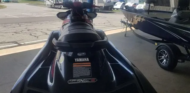 Slide: The Image of 2019 Yamaha WaveRunner GP1800R jet ski parked near a boat. - 6