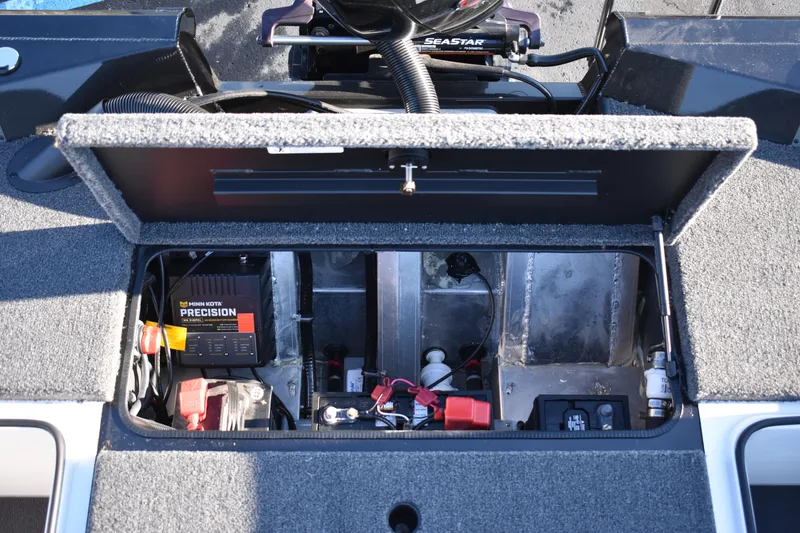 Slide: The Image of 2023 Vexus AVX1980C boat battery compartment with Minn Kota Precision charger. - 15