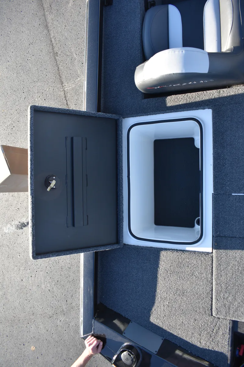 Slide: The Image of 2023 Vexus AVX1980C boat storage compartment with open lid and seating. - 17