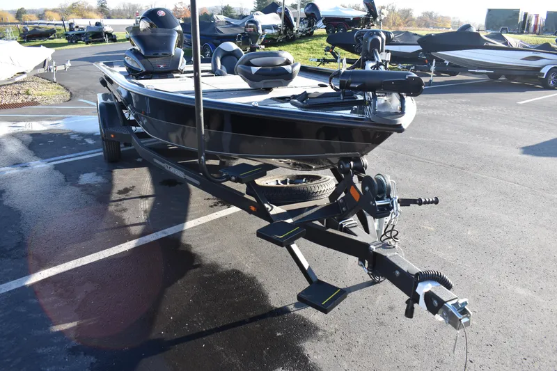 Slide: The Image of 2023 Vexus AVX1980C fishing boat on a trailer in a parking lot. - 19
