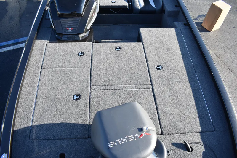 Slide: The Image of 2023 Vexus AVX1980C boat interior with carpeted deck and storage compartments. - 4