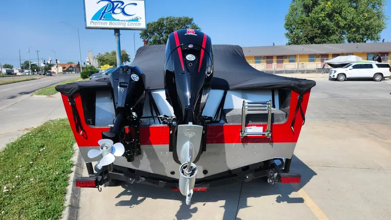 Slide: The Image of 2025 Lund 1875 Fisherman boat with dual motors at a dealership. - 10