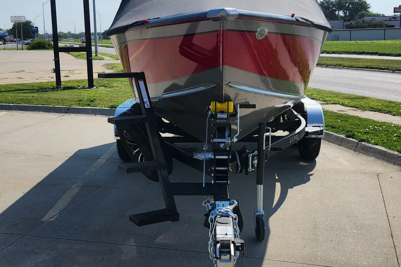 Slide: The Image of 2025 Lund 1875 Fisherman boat on trailer, parked on concrete surface. - 12