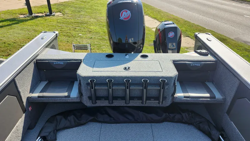 Slide: The Image of 2025 Lund 1875 Fisherman boat interior with motor and seating. - 14