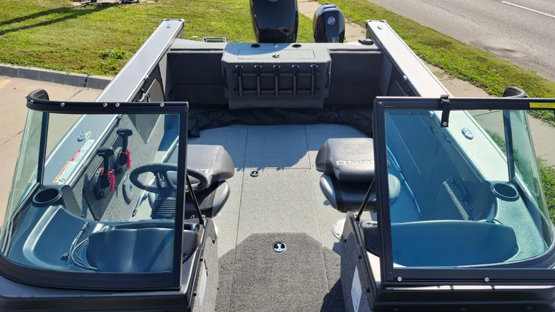 Slide: The Image of 2025 Lund 1875 Fisherman boat interior with seating and steering console. - 20