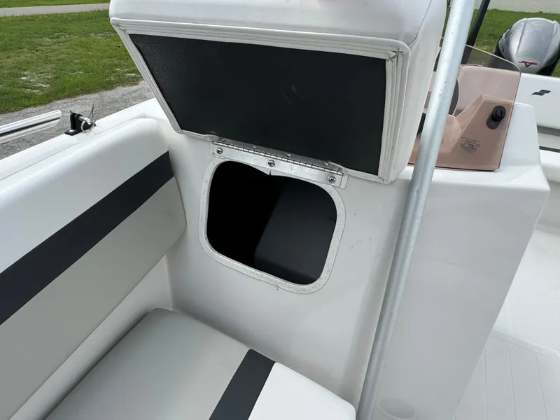 Slide: The Image of 2023 Starcraft SVX 171 OB boat storage compartment with open hatch. - 10