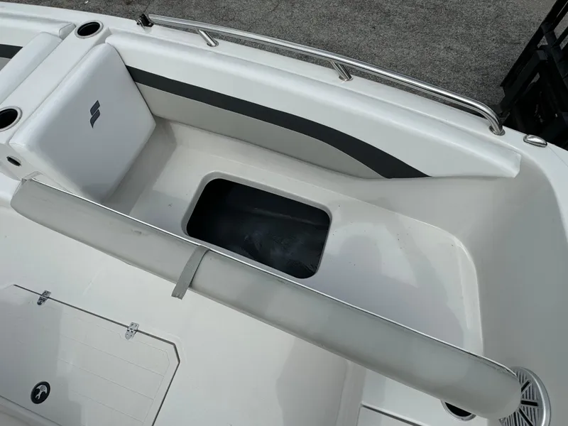 Slide: The Image of 2023 Starcraft SVX 171 OB boat interior with seating and storage compartment. - 11