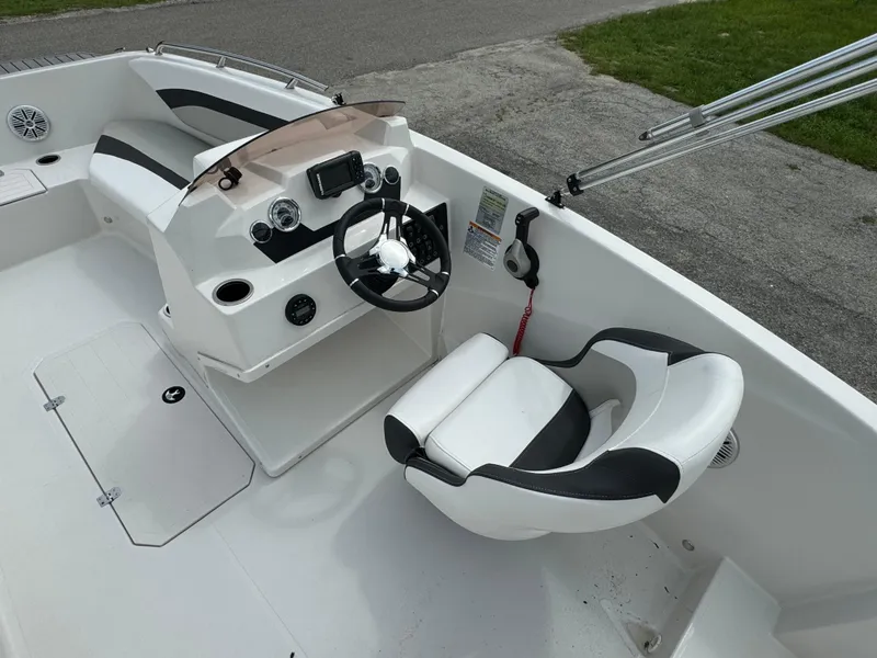 Slide: The Image of 2023 Starcraft SVX 171 OB boat interior with steering console and seating. - 14