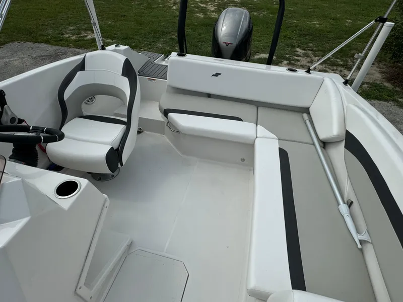 Slide: The Image of 2023 Starcraft SVX 171 OB boat interior with seating and steering wheel. - 15