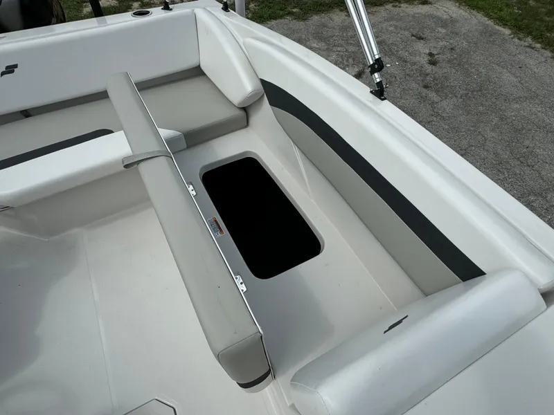 Slide: The Image of 2023 Starcraft SVX 171 OB boat interior with open storage compartment. - 16
