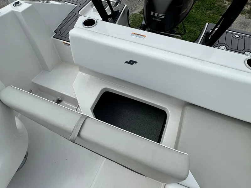 Slide: The Image of 2023 Starcraft SVX 171 OB boat interior with seating and storage compartment. - 17