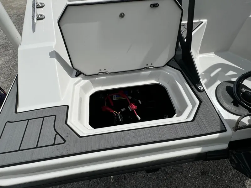 Slide: The Image of 2023 Starcraft SVX 171 OB boat storage compartment with open hatch. - 20