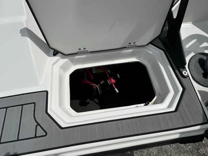Slide: The Image of Open storage compartment on 2023 Starcraft SVX 171 OB boat. - 21