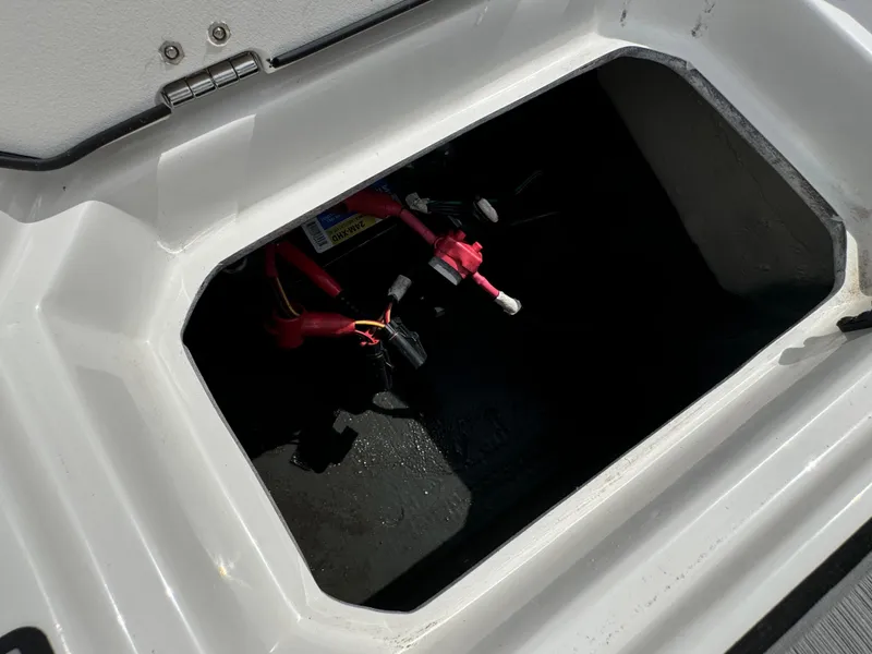 Slide: The Image of 2023 Starcraft SVX 171 OB boat storage compartment with visible wiring. - 22