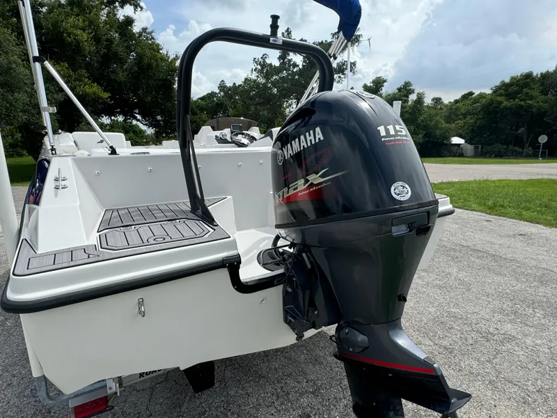 Slide: The Image of 2023 Starcraft SVX 171 OB boat with Yamaha 115 outboard motor, parked on pavement. - 26